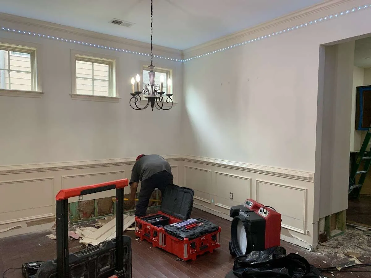 Restoration technician with professional equipment in Belmont